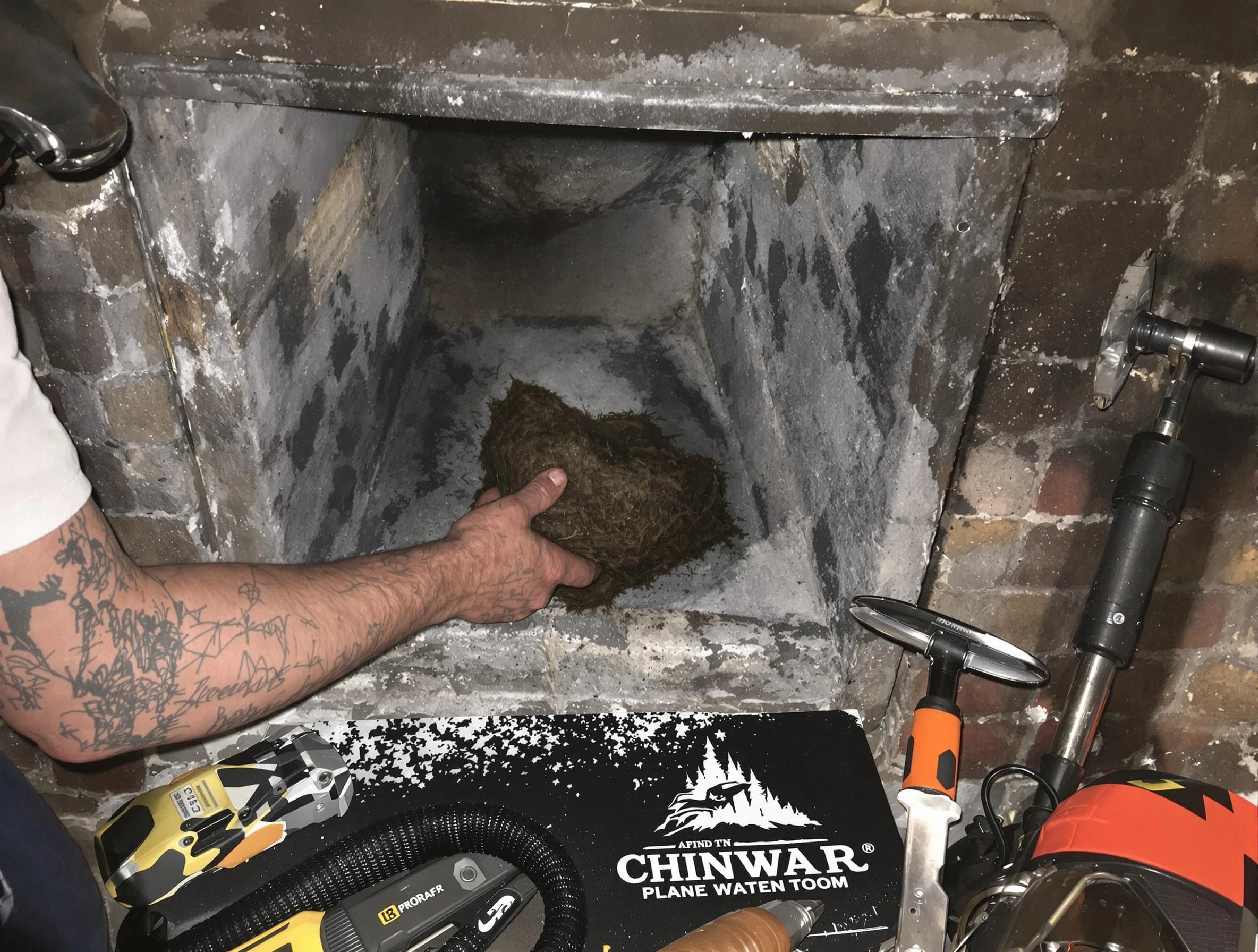 Lakewood Chimney Sweep safely removing debris and screening chimney in Lakewood, NJ